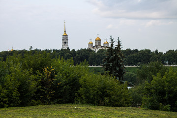 View of the Dormition Cathedral of green trees in Vladimir, Russia on a summer day