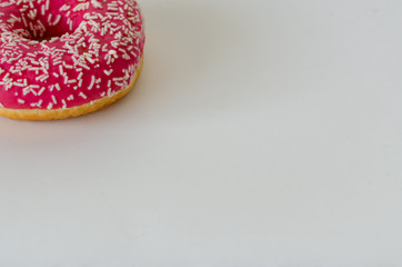 One pink donut on white  background.