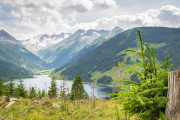 Scenic view of a lake and snow capped mountains near Gerlos in Tirol, Austria
