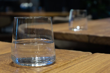 transparent glass of water on a wooden table