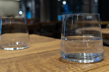 transparent glass of water on a wooden table