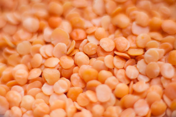 Heap of raw red lentils close-up macro shot