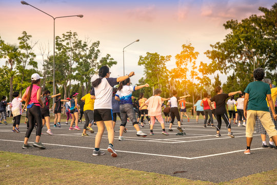 Back View Of Group People Workout Exercise With Dancing A Fitness Dance Or Aerobics In City Park