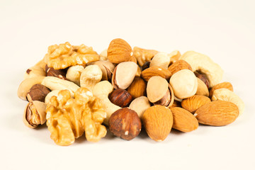 Mix nuts and dry fruits on a white background