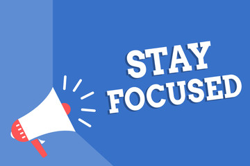 Handwriting text writing Stay Focused. Concept meaning Be attentive Concentrate Prioritize the task Avoid distractions Megaphone loudspeaker blue background important message speaking loud