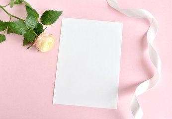 Blank paper on pink background, minimal mockup for wedding invitation, greeting card.