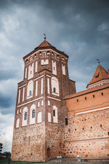 Obraz premium Medieval architecture against a stormy dark sky - brick castle