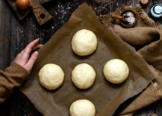 overhead shot of homemade unbaked tasty buns for burger or breakfast