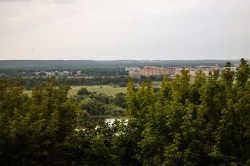 Fototapeta na wymiar Panorama of the valley with a car bridge over the river Klyazma summer day in Vladimir Russia