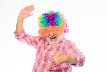 Fun time. happy man with beard. Celebration retirement. Crazy man in playful mood. happy birthday. corporate party. anniversary holiday. mature bearded man in colorful wig and party glasses