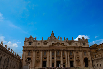 Fototapeta na wymiar St. Peter's Basilica during the day with a beautiful blue sky in the Vatican