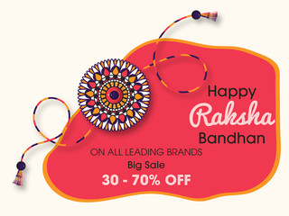 Beautiful rakhi with gems on shiny red and beige background for the festival of Raksha Bandhan celebrations.