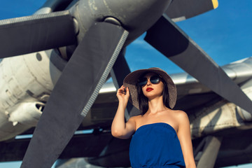 Brunette in a dress at the old airport
