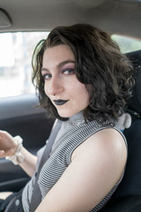 young goth girl short hair sitting in car
