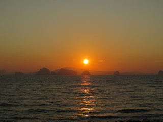 Orange sunset at Klong Jak Beach, Thailand