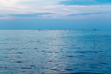 Coastline of the sea in the rays of the setting sun