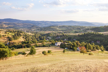 Fototapeta premium Nature and environment. Fields and hills. Mountain landscape in the summer. Travel, tourism and agriculture. Slovakia