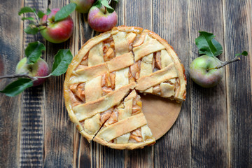 Homemade delicious Apple pie on wooden background Autumn baking 
