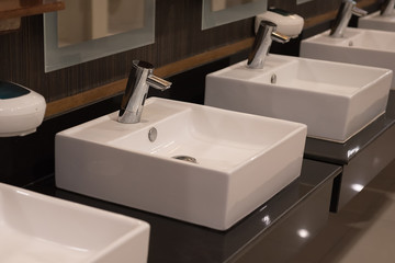 Modern bathroom faucet on a white sink