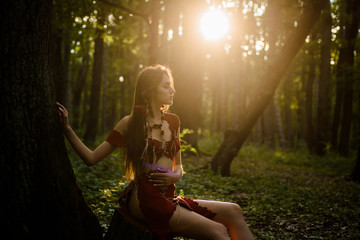 Wild attractive woman in forest. Folklore character. Female spirit mythology. Living wild life...