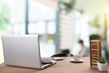 .Desk Workplace with a comfortable work table in the background that is used