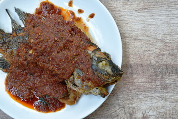 batter fried mango fish dressing spicy fish sauce on plate