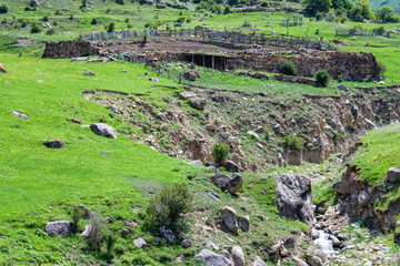 Distant view of rural dwelling made of stone in the mountains