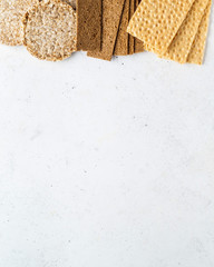 Different types of crispbread (whole-grain buckwheat, rye, wheat, oat).