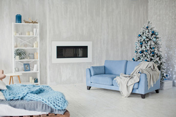 blue sofa and Christmas tree