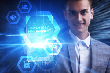 The concept of business, technology, the Internet and the network. A young entrepreneur working on a virtual screen of the future and sees the inscription: Inventory management