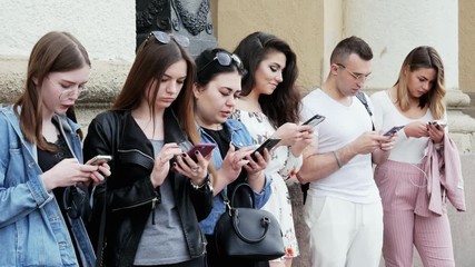 Group of people using the mobile phone, surf the Internet, play the game and use the app, addiction concept