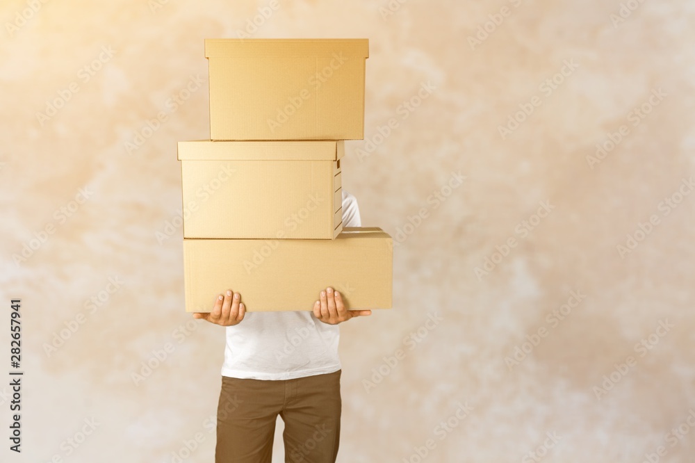 Sticker Delivery man carrying stacked boxes in front of face against  background