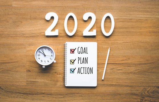 2020 New Year Goal,plan,action Text On Notepad On Wood Background.Business Challenge.Inspiration Ideas