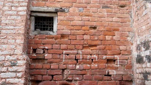 pan of bullet marks on a wall at jallianwala bagh massacre site in amritsar, india
