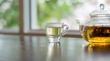 hot tea on wood table, a cup of tea