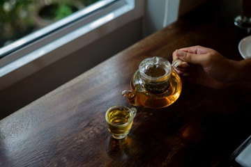 hot tea on wood table, a cup of tea, Teapot handle