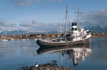 Fototapeta premium Warm sunset over old abandoned boat, Patagonia