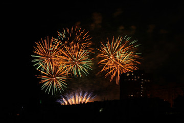 Fototapeta na wymiar Beautiful colorful holiday fireworks in the night sky, long exposure