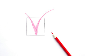 Red tick drawn  with pencil isolated on white background. Top view, flat lay composition