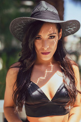 Tall mixed race woman in summer fashion poses outdoors