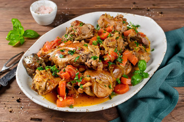 Roasted rabbit with vegetables and white wine sauce