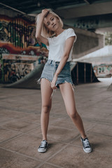 Beauty portrait of sexy pretty blonde girl posing on urban background. Stylish fashion beauty woman...