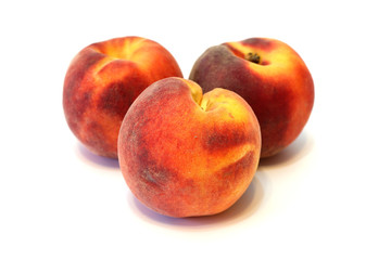 Fototapeta na wymiar Juicy fresh peaches on white background close up isolated