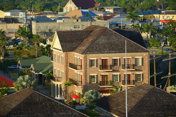 Falmouth CourtHouse and St. Peter's Anglican Church at downtown Falmouth, Jamaica. The courhouse was built in 1817 with Jamaican Georgian architectural style at downtown Falmouth, Jamaica. Today this  - obrazy, fototapety, plakaty