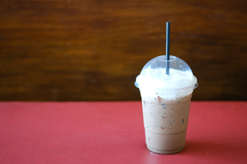 Iced coffee mocha on red table