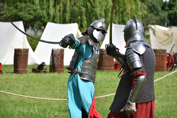 Fight of medieval Polish knights with sabres. Historical reenactment in Brodnowski park in Warsaw, Poland - 282670901
