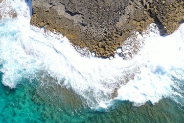 Aerial view to ocean waves and coast