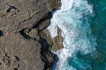 Aerial view to ocean waves and coast