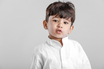 Indian little boy in Traditional Wear and Showing multi pal expression  