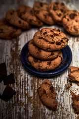 group of tasty cookies next to a bowl